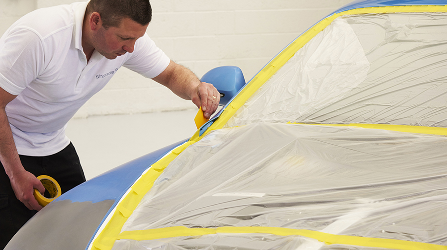 automotive masking tape applied to a car door