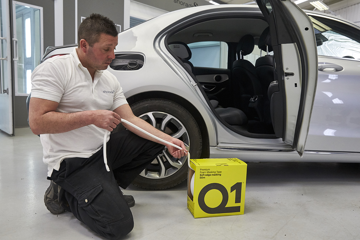 Application of masking tape on a car by Shorade body shop