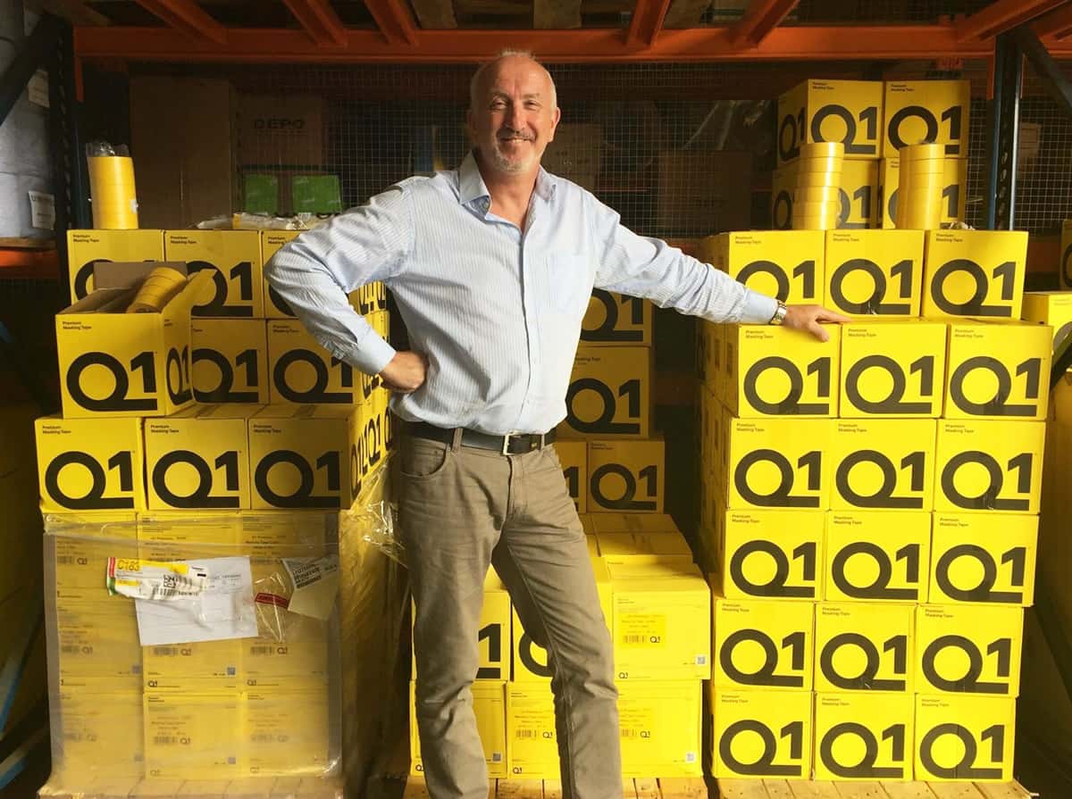 Mr. Jonathan Penny with Q1 masking tapes boxes