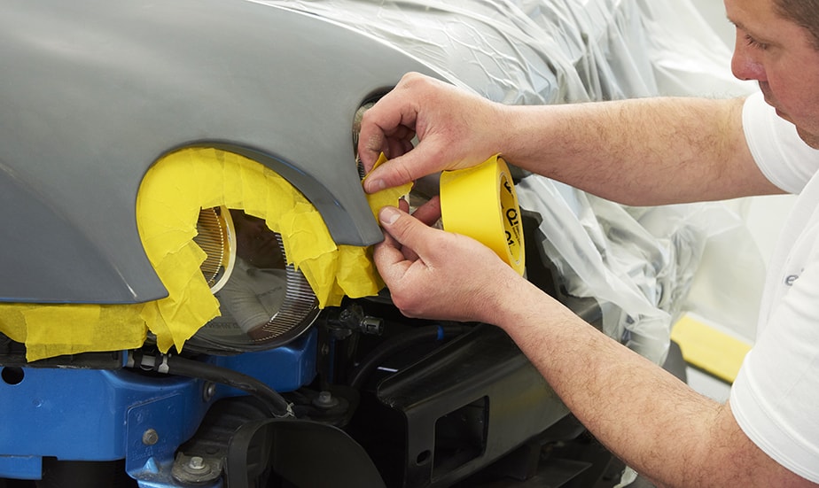 masking a car before painting